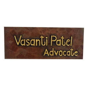 Vasanti Patel's office desk wooden nameplate