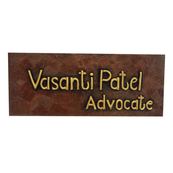 Vasanti Patel's office desk wooden nameplate