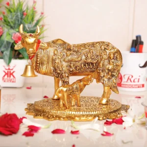 Gold Plated Kamdhenu Cow with Calf Metal Statue for Good Luck Feng Shui & Vastu Showpiece As Table Top Religious idol Gau Mata for Home Office Decorative,Animal Showpiece Figurines,Festive Gift Article...