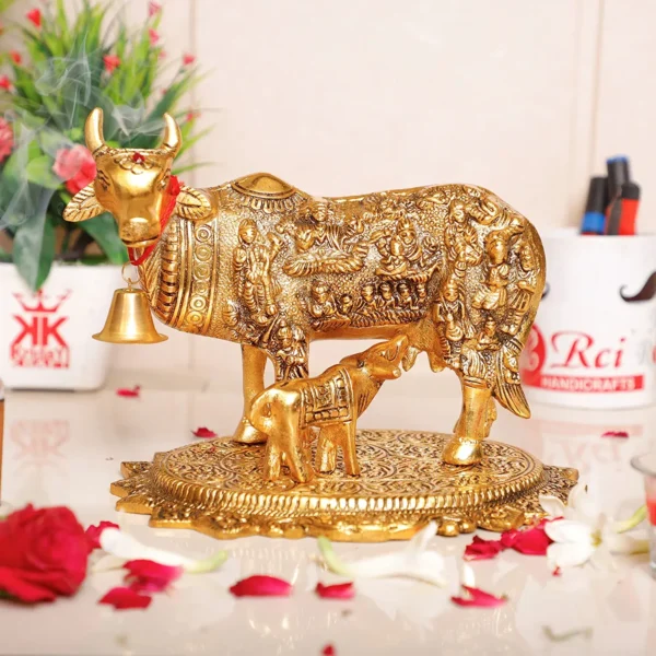 Gold Plated Kamdhenu Cow with Calf Metal Statue for Good Luck Feng Shui & Vastu Showpiece As Table Top Religious idol Gau Mata for Home Office Decorative,Animal Showpiece Figurines,Festive Gift Article...