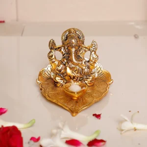 Metal Lord Ganesha On Leaf with Diya Idol for Pooja Room Showpiece for Room,Office & Table,car and Gift for Have Anniversaries, Birthday.